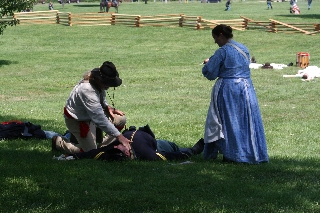 The Scout and nurse Kara minister to injured Alex